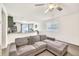Open-concept living area featuring a comfortable sofa and easy access to the kitchen at 25787 W Allen St, Buckeye, AZ 85326