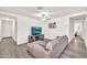 Comfortable living room with stylish furnishings, neutral colors, and plenty of natural light at 25787 W Allen St, Buckeye, AZ 85326