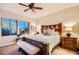 Comfortable bedroom with a large bed, elegant furnishings, and ample natural light from the windows at 27000 N Alma School Pkwy # 1033, Scottsdale, AZ 85262