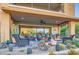 Relaxing outdoor space with desert landscaping, patio seating, and scenic views of the surrounding area at 27000 N Alma School Pkwy # 1033, Scottsdale, AZ 85262