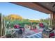 Relaxing outdoor patio with scenic views, comfortable seating, and desert-style landscaping at 27000 N Alma School Pkwy # 1033, Scottsdale, AZ 85262
