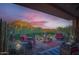 Relaxing covered patio with cozy seating, desert plants, and scenic mountain views at sunset at 27000 N Alma School Pkwy # 1033, Scottsdale, AZ 85262
