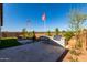 Backyard features a built-in grill, bar seating and tidy landscaping at 27647 N 176Th Dr, Surprise, AZ 85387