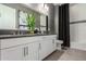 Modern bathroom boasting a double vanity, stylish tile work, and sleek fixtures at 27647 N 176Th Dr, Surprise, AZ 85387