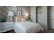 This bedroom features bright walls with artwork, modern decor, and access to a closet at 27647 N 176Th Dr, Surprise, AZ 85387