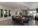 Chic dining room showcasing modern lighting, stylish table setting, and an open-concept layout at 27647 N 176Th Dr, Surprise, AZ 85387