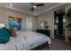 This stylish main bedroom features modern decor, with easy access to a private ensuite bathroom at 27647 N 176Th Dr, Surprise, AZ 85387