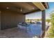 Inviting covered patio with dining area and built-in grill perfect for entertaining at 27647 N 176Th Dr, Surprise, AZ 85387