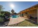 Relax in this backyard oasis with a refreshing pool, charming patio, and lush green space for outdoor enjoyment at 2933 W Del Mar Ln, Phoenix, AZ 85053