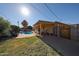 This backyard features a covered patio, sparkling pool, and ample space for outdoor activities and relaxation at 2933 W Del Mar Ln, Phoenix, AZ 85053
