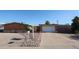 Charming single story home with a brick facade, low maintenance desert landscaping, and a driveway leading to a single garage at 2933 W Del Mar Ln, Phoenix, AZ 85053
