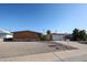 Exterior of a single-story brick home featuring desert landscaping and a driveway leading to a single-car garage at 2933 W Del Mar Ln, Phoenix, AZ 85053