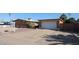 A single story brick home with desert landscaping, a long driveway, and a one car garage in a sunny setting at 2933 W Del Mar Ln, Phoenix, AZ 85053