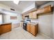 Functional kitchen featuring wood cabinets, modern appliances, tile flooring, and an open layout at 2933 W Del Mar Ln, Phoenix, AZ 85053