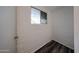 Empty room showcasing painted brick wall and wood-look floors at 2933 W Del Mar Ln, Phoenix, AZ 85053