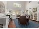 Bright dining room featuring high ceilings, large windows, a wooden table, and a blue patterned rug at 3222 E Cortez St, Phoenix, AZ 85028
