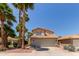 Charming two-story home boasting a tile roof, desert landscaping, and two-car garage at 3222 E Cortez St, Phoenix, AZ 85028