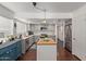 Bright kitchen with stainless steel appliances, center island with wood countertop, and updated cabinetry at 3222 E Cortez St, Phoenix, AZ 85028