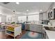 Kitchen featuring updated stainless appliances, white countertops, and a view to the living area at 3222 E Cortez St, Phoenix, AZ 85028
