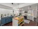 Charming updated kitchen featuring grey cabinets, modern appliances, an island and stylish decor at 3222 E Cortez St, Phoenix, AZ 85028