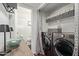 Convenient laundry area with modern appliances and storage solutions, with a bathroom viewable beyond at 3222 E Cortez St, Phoenix, AZ 85028