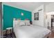 Comfortable bedroom with a stylish bed, headboard book shelves, and accent wall at 3222 E Cortez St, Phoenix, AZ 85028