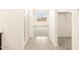 Hallway leading to bathroom with glass shower, bedroom with carpet, and closet at 328 S San Christo Ln, Casa Grande, AZ 85194