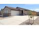 Charming single-story home with a two-car garage, easy-care landscaping, and a concrete driveway at 328 S San Christo Ln, Casa Grande, AZ 85194