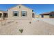 Inviting single-story house featuring shuttered windows, desert landscaping, and a tile roof at 329 S San Christo Ln, Casa Grande, AZ 85194