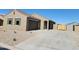 Charming single-story house featuring desert landscaping and a two-car garage at 329 S San Christo Ln, Casa Grande, AZ 85194