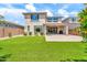 A spacious backyard with artificial grass and a paved patio area at 3417 E Los Gatos Dr, Phoenix, AZ 85050