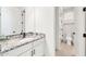 Cozy bathroom boasts vanity with a granite countertop, complemented by neutral tones and natural light at 3417 E Los Gatos Dr, Phoenix, AZ 85050