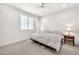 Minimalist bedroom showcasing a comfortable bed between bedside tables, complemented by neutral tones and natural light at 3417 E Los Gatos Dr, Phoenix, AZ 85050