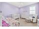 ' bedroom is decorated with light purple walls, complemented by soft furnishings and cozy furniture at 3417 E Los Gatos Dr, Phoenix, AZ 85050
