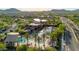 Aerial view of the community pool, including palm trees, covered tables, and lounge seating at 3417 E Los Gatos Dr, Phoenix, AZ 85050