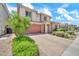 Stunning two-story home with a brick driveway and a lush, green garden in a sunny neighborhood at 3417 E Los Gatos Dr, Phoenix, AZ 85050