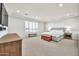 Spacious main bedroom featuring a king bed, neutral colors, plantation shutters, and recessed lighting at 3417 E Los Gatos Dr, Phoenix, AZ 85050