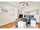 This is a well lit office area with a large computer display, overhead fan and decorative wall art at 3417 E Los Gatos Dr, Phoenix, AZ 85050