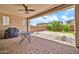 Covered patio area featuring a table and grill, perfect for outdoor dining at 3417 E Los Gatos Dr, Phoenix, AZ 85050