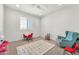 Bright playroom filled with a play kitchen, table, comfy chair and large play mat at 3417 E Los Gatos Dr, Phoenix, AZ 85050