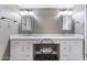 This bathroom features a dual sink vanity, a center chair spot, and modern lighting at 3512 S Elm St, Tempe, AZ 85282
