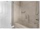Cozy bathroom featuring a tub with modern shower fixture and a convenient towel rack at 3512 S Elm St, Tempe, AZ 85282
