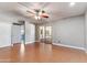 This bedroom features wood floors and has a sliding glass door leading to another room in the house at 3512 S Elm St, Tempe, AZ 85282