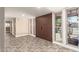 Spacious entryway featuring tile flooring, a double door entrance, and natural lighting from large windows at 3512 S Elm St, Tempe, AZ 85282