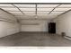 Spacious two car garage with white brick and pull down door at 3512 S Elm St, Tempe, AZ 85282