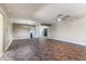 Bright living room features tile floors, a modern ceiling fan, and an elegant chandelier above at 3512 S Elm St, Tempe, AZ 85282