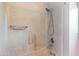 Shower featuring a shower head and grab bar at 3512 S Elm St, Tempe, AZ 85282