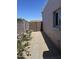 Charming side yard featuring a gravel path and a colorful flower garden along the side of the house at 3512 S Elm St, Tempe, AZ 85282