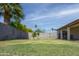 Large, well-maintained backyard with grass and block wall fencing at 3519 W Libby St, Glendale, AZ 85308