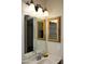 Bathroom vanity with 3 light fixture and ornate mirrors at 3519 W Libby St, Glendale, AZ 85308